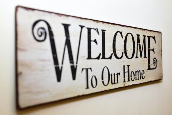 A stylish rustic wooden welcome sign perfect for home decoration.